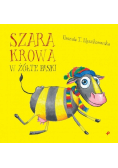 Szara krowa w żółte paski