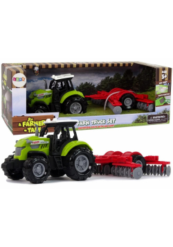 Traktor ze zgrabiarką zielony